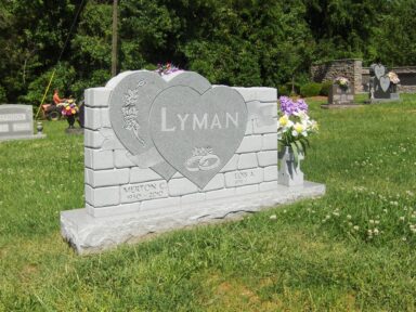 Lyman - Grey Brick Facade with Two Heart design