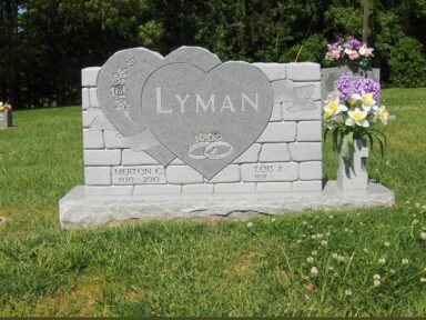 12b - FROSTED LETTERING ON A POLISHED DOUBLE HEART ON A SCULPTED MONUMENT